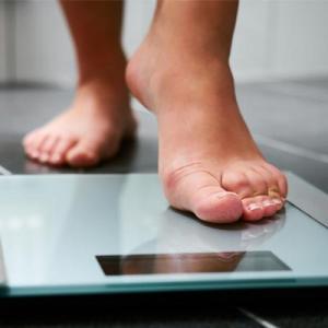 Person stepping on scales
