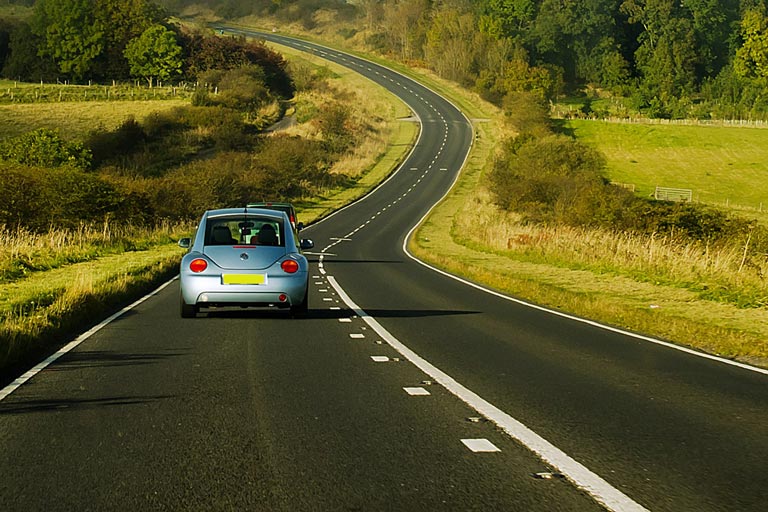 car driving through countryside